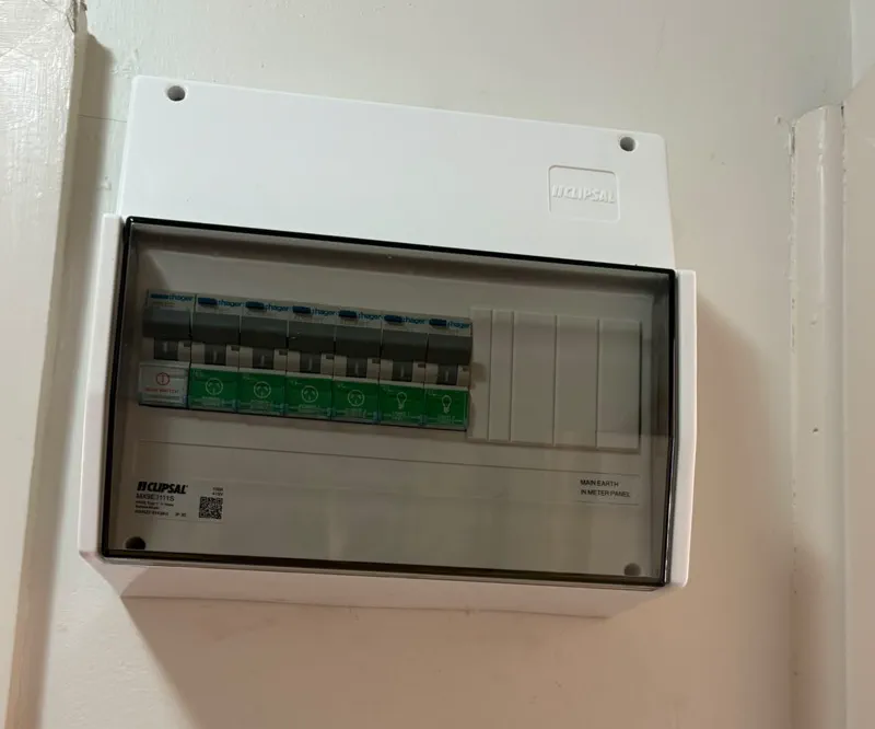 Clipsal switchboard with a Hager main switch and six Hager RCBOs for the power and lighting circuits