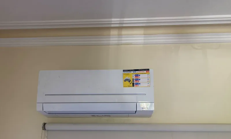 Mitsubishi Electric wall split with its energy rating label still on the front panel