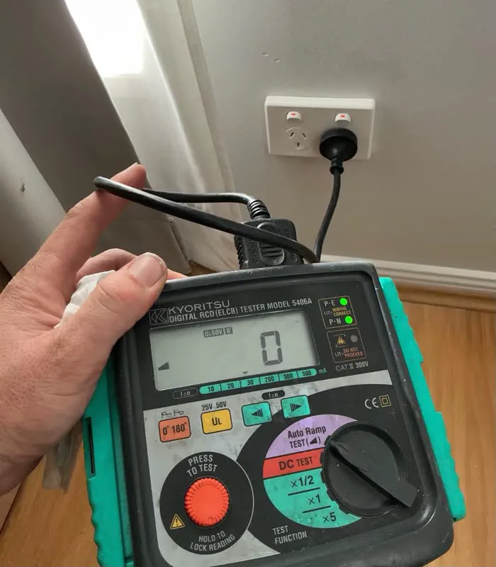 Kyoritsu RCD tester plugged into a double power point inside a home