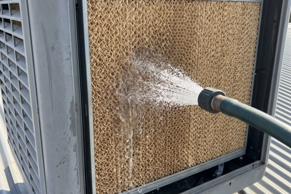 Evaporative cooler pads during a service