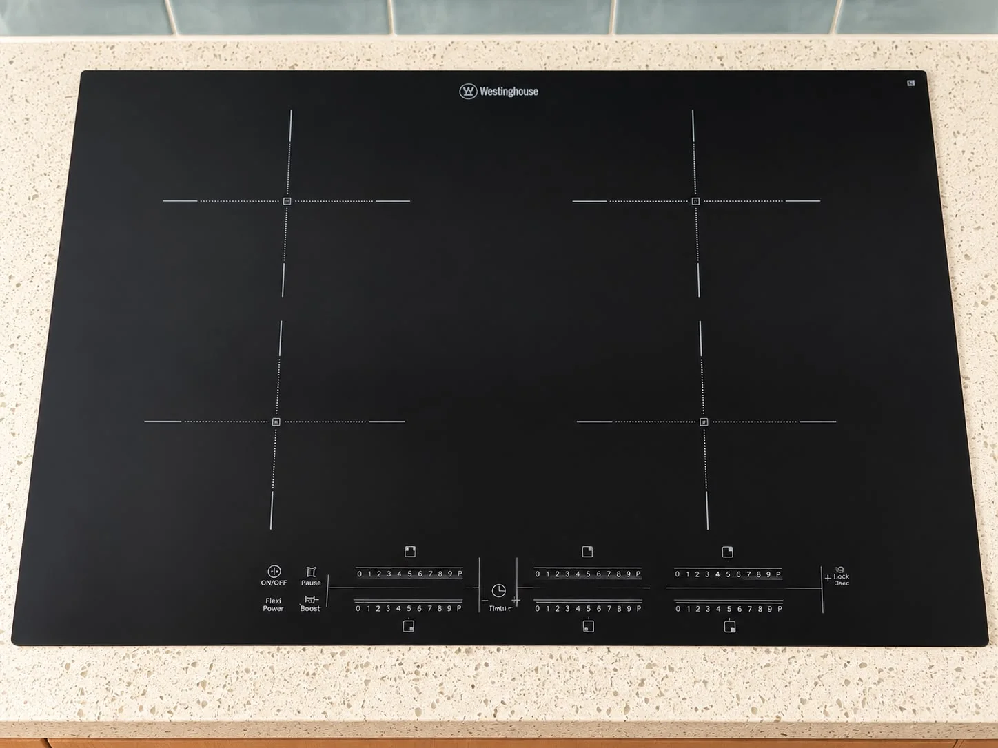 Black Westinghouse induction cooktop in a kitchen benchtop